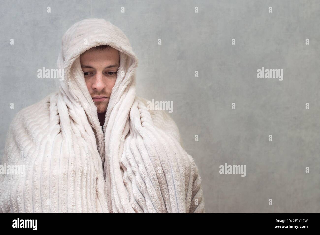 man covered himself with a blanket. Panic attack concept Stock Photo