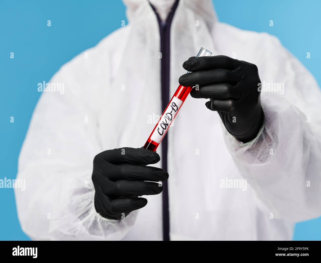 Laboratory black gloves blood test sleeve research blue background ...