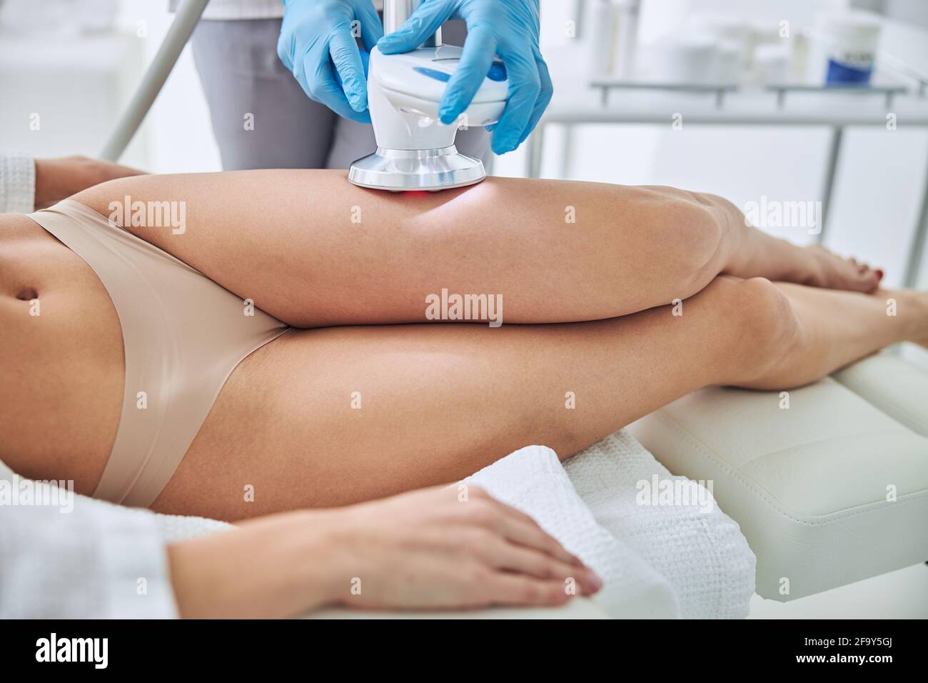 Image of non surgical body sculpting in wellness center Stock Photo