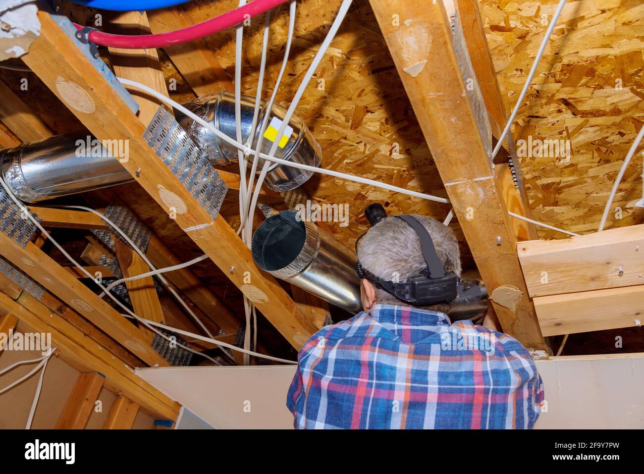 Remodelling system HVAC duct ventilation pipes the installation in central conditioning a ceiling Stock Photo