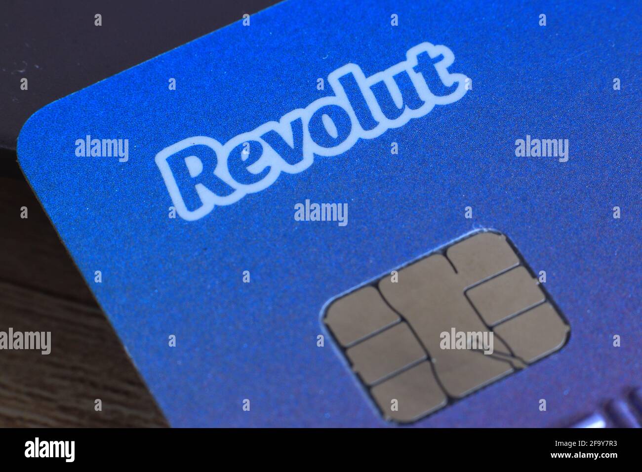 Berlin, Germany - April 21, 2021: Revolut logo on a bank card. Revolut is a fast, simple, and easy way to buy, sell, and hold cryptocurrencies Stock Photo