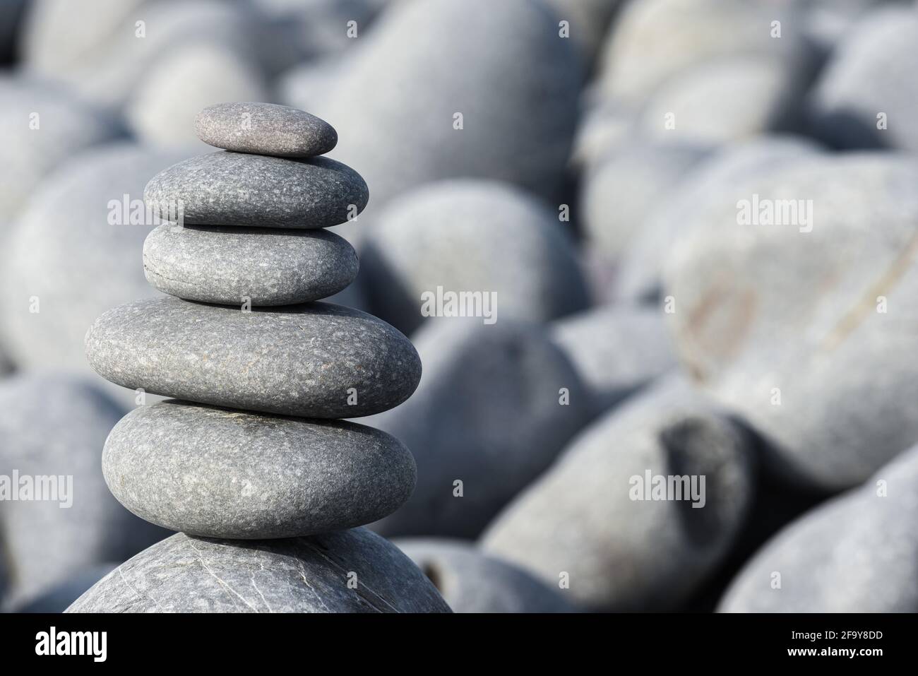 Pebble stack on the beach the stones represent balance and wellbeing of ...