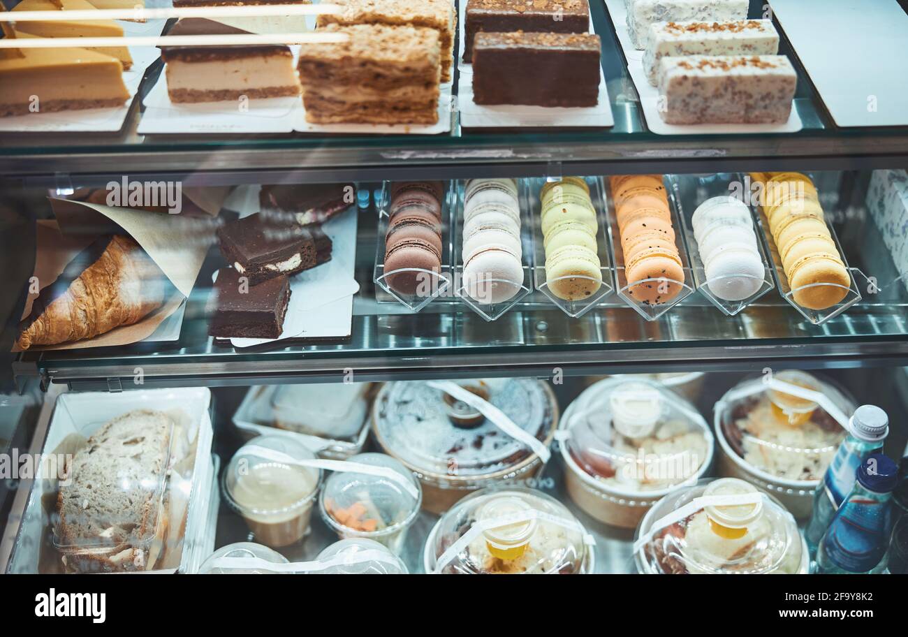 Tasty treats and various desserts assortment under the glass Stock Photo