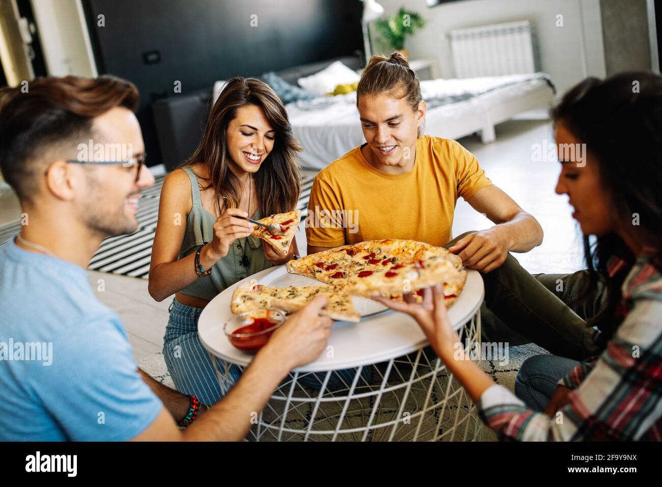 close-up image, A group of friends eating pizza in the party together. New  year party, Birthday party, Pizza party at home Stock Photo - Alamy