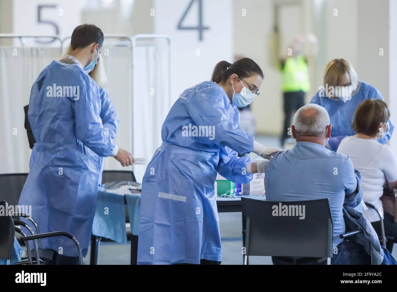 Zagreb, Croatia. 21th April 2021. Organized mass vaccination of citizens with the Pfizer vaccine  against Covid 19 virus in pavilion 6 of the Zagreb Fair. Medical workers vaccinate citizens. Stock Photo