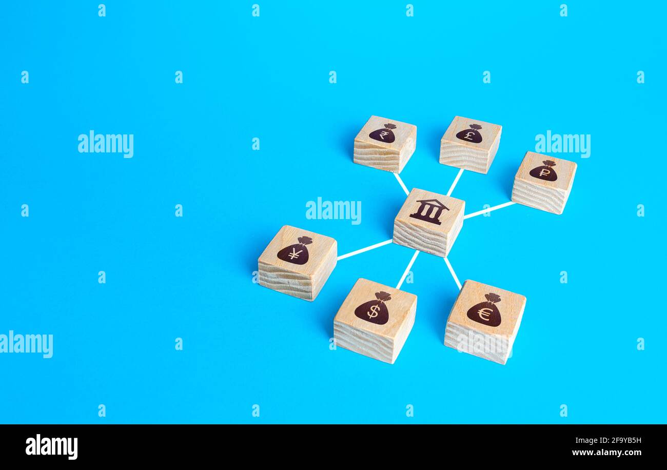 Linked blocks bank and world currencies money bags. Financial system, national foreign exchange reserve concept. Credit resources on capital markets. Stock Photo
