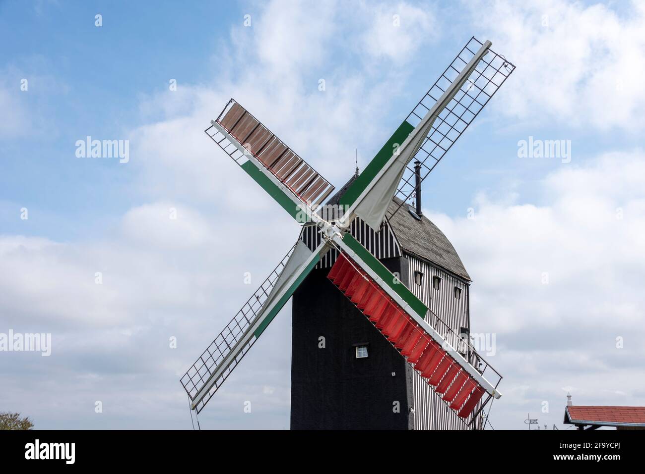 Alleringersleben, Germany. 18th Apr, 2021. Red-green wings are the trademark of the Bockwindmühle Eimersleben in the Magdeburger Börde. The mill, built in 1848, was used to grind grain until 1952. Since its reconstruction, it has been inhabited and is open to visitors. Credit: Stephan Schulz/dpa-Zentralbild/ZB/dpa/Alamy Live News Stock Photo