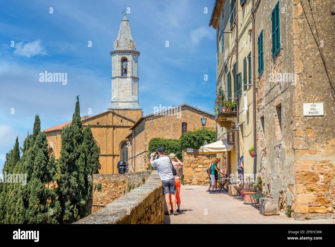 Pienza, Siena Province, Tuscany, Italy.  View from walk along city walls to the tower of Cattedrale di Santa Maria Assunta - the Cathedral of Holy Mar Stock Photo
