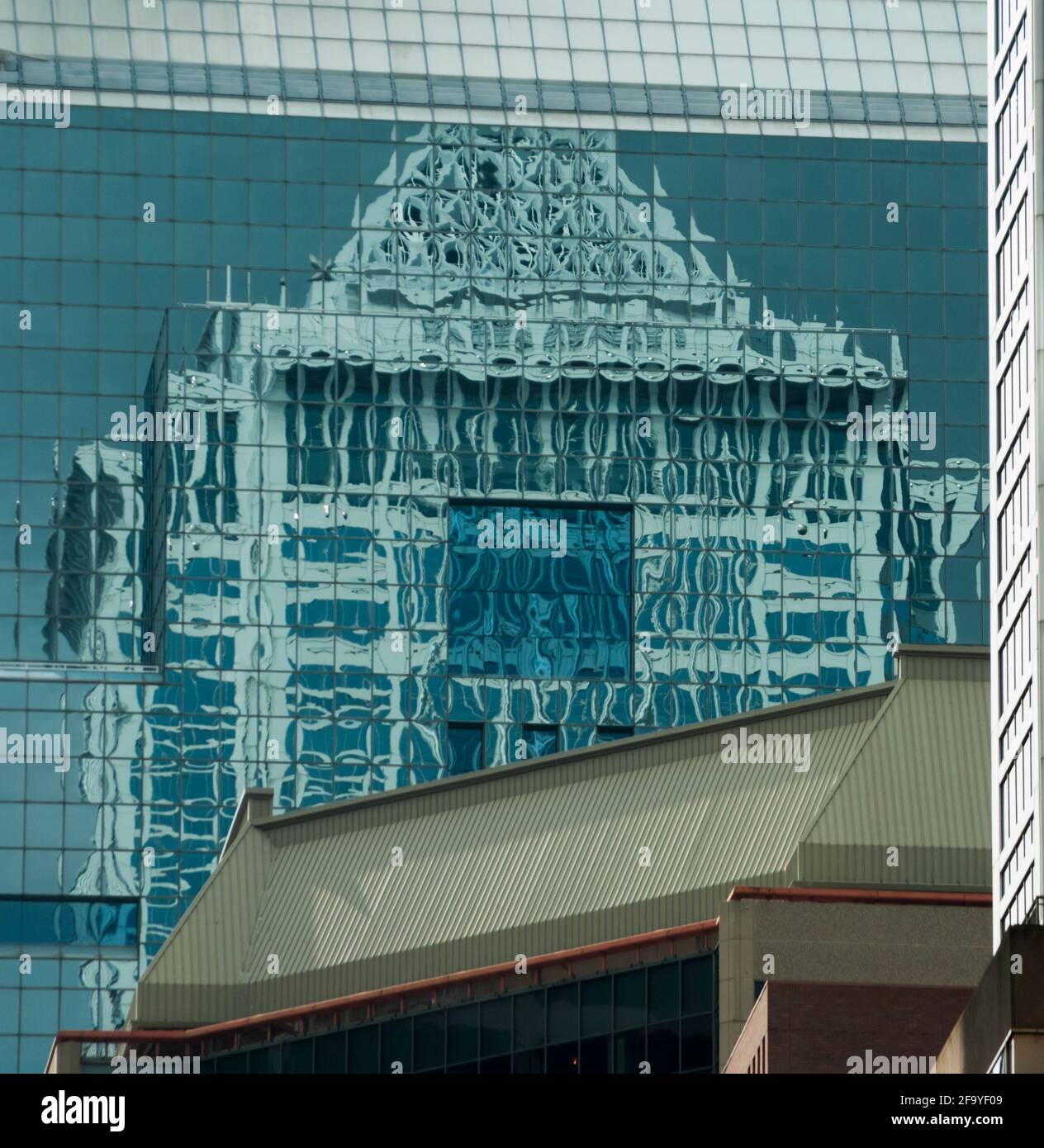 Reflections of Two Liberty Place in the mirrored windows of another tall building. Philadelphia USA. Stock Photo