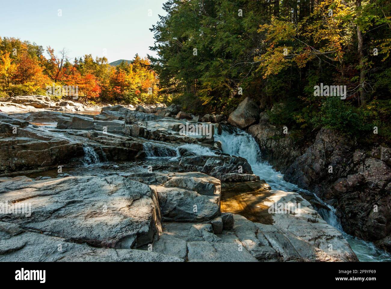 The rocky Pemigewasset River just off the Kancamagus Highway, New Hampshire, USA in autumn / fall. Stock Photo