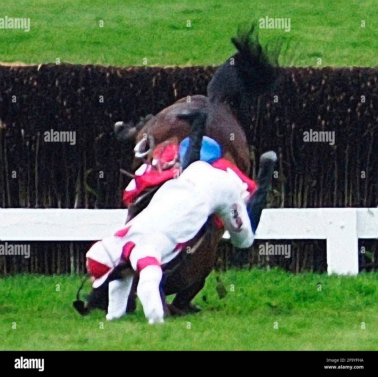 CHELTENHAM FESTIVAL. THE GOLD CUP. LOOKS LIKE TROUBLE (RIGHT) AFTER THE 2ND LAST WITH GLORIA VICTIS FALLING. 16/3/00. PICTURE DAVID ASHDOWN. Stock Photo