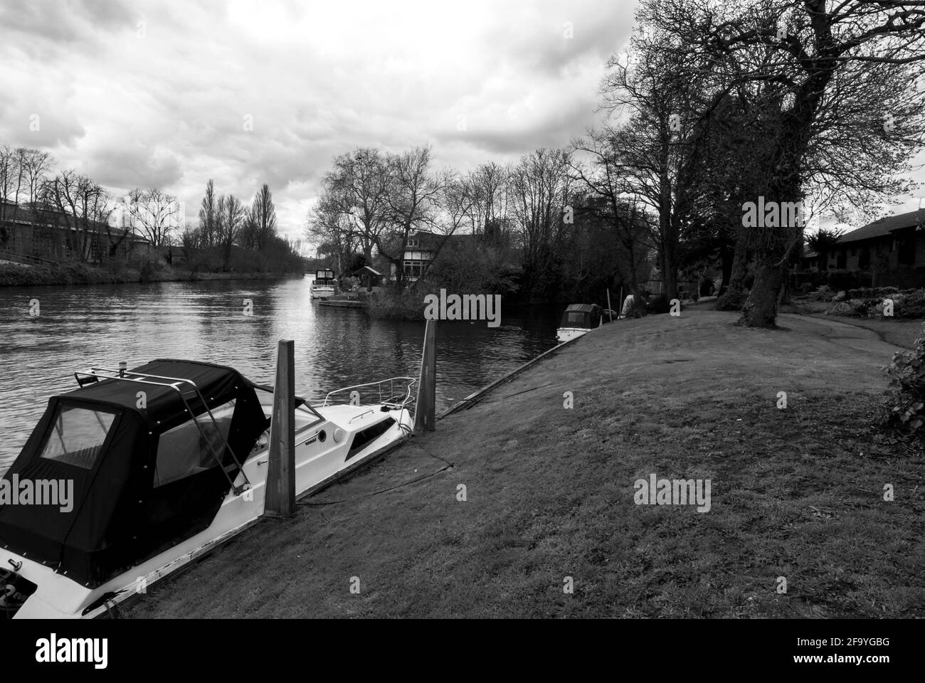 A boat moored near Church Island on the River Thames, Staines, UK. B&W Stock Photo