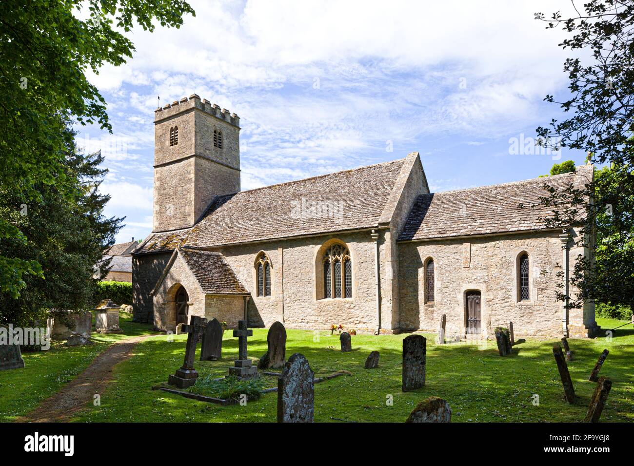 The Saxon church of St Andrew in the Cotswold village of Coln Rogers, Gloucestershire UK Stock Photo