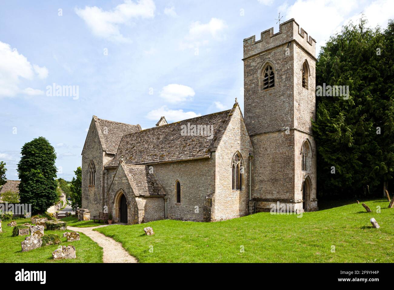 The Norman church of St Nicholas in the Cotswold village of Asthall, Oxfordshire UK Stock Photo