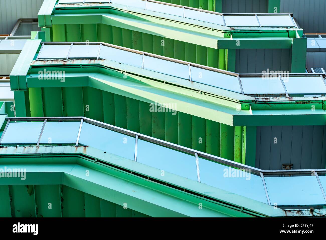 green fire escape ladders on building, Exterior view Stock Photo Alamy