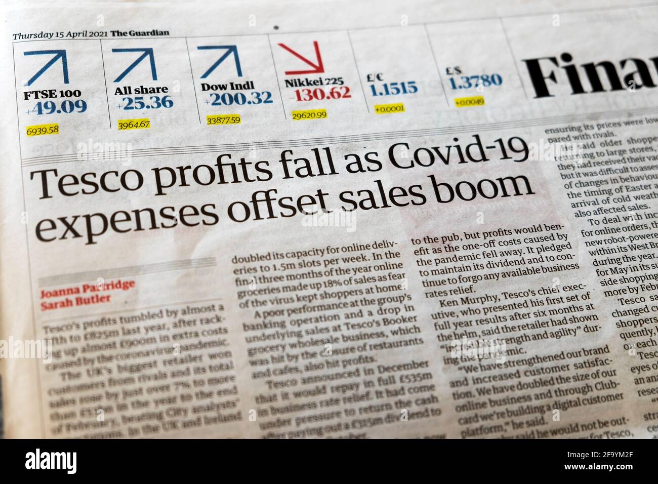'Tesco profits fall as Covid-19 expenses offset sales boom' Financial Guardian  newspaper headline business page 15 April 2021 London England UK Stock Photo