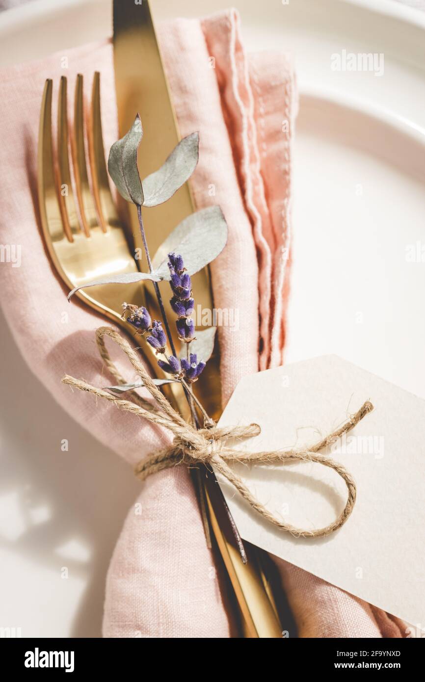 Close up view on table setting details on white plates. Stock Photo