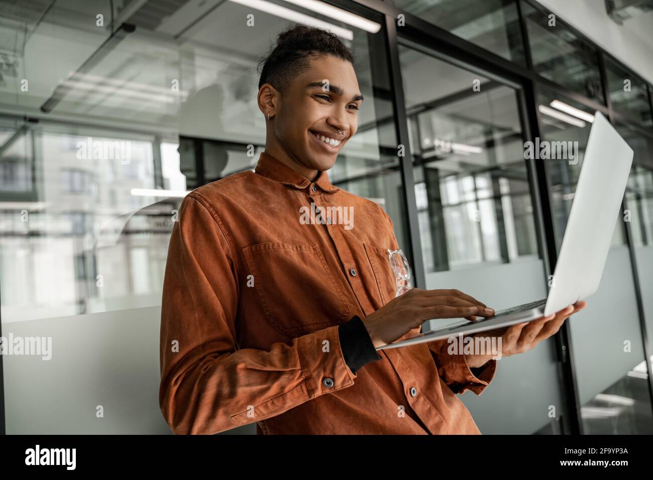 happy african american student using laptop Stock Photo - Alamy