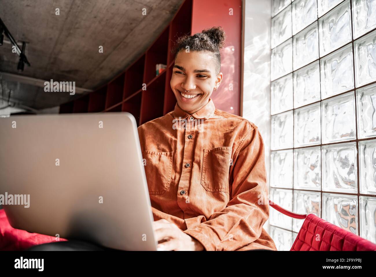 happy african american student in glasses using laptop Stock Photo - Alamy