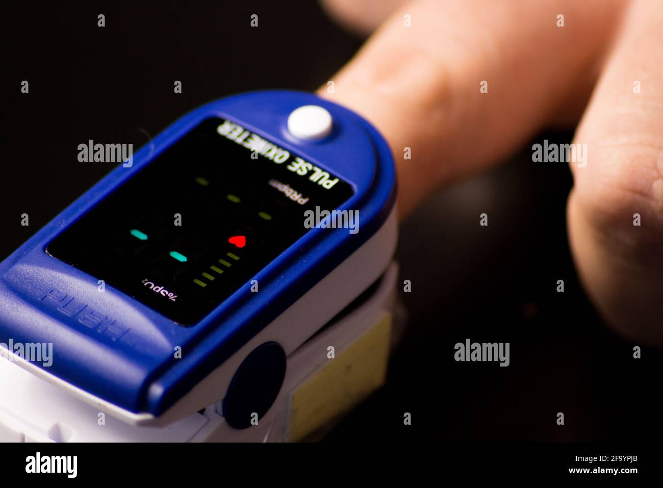 Pulse oximeter with hand of patient. Pulse Oximeter portable digital