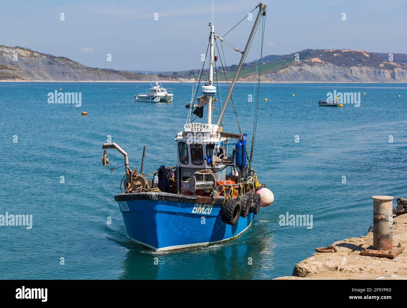 Slippery Dick fishing boat returning to harbour at Lyme Regis, Dorset ...
