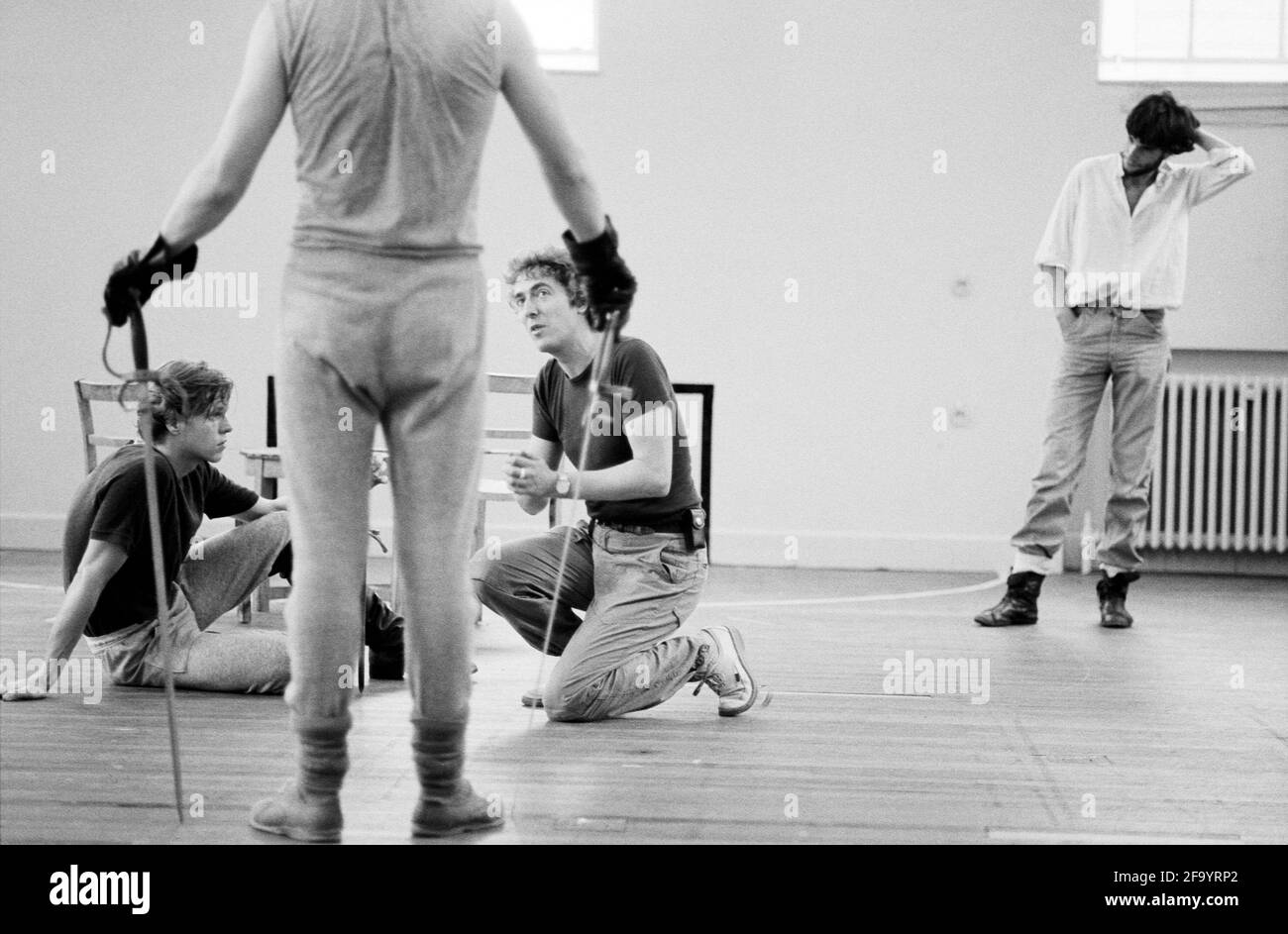 l-r: Simon Templeman (Tybalt), Roger Allam (Mercutio - back to camera), Malcolm Ranson (fight director) and Daniel Day-Lewis (Romeo) during a fight rehearsal for ROMEO AND JULIET by Shakespeare for the Royal Shakespeare Company (RSC) 1983 Regional Tour set design: Bob Crowley costumes: Priscilla Truett lighting: Brian Harris fights: Malcolm Ranson  director: John Caird Stock Photo