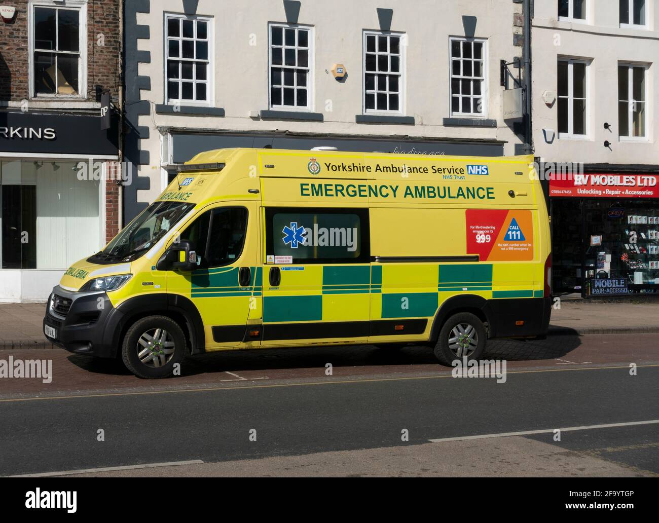 Emergency NHS Yorkshire Ambulance on the High Street in Northallerton North Yorkshire Stock Photo