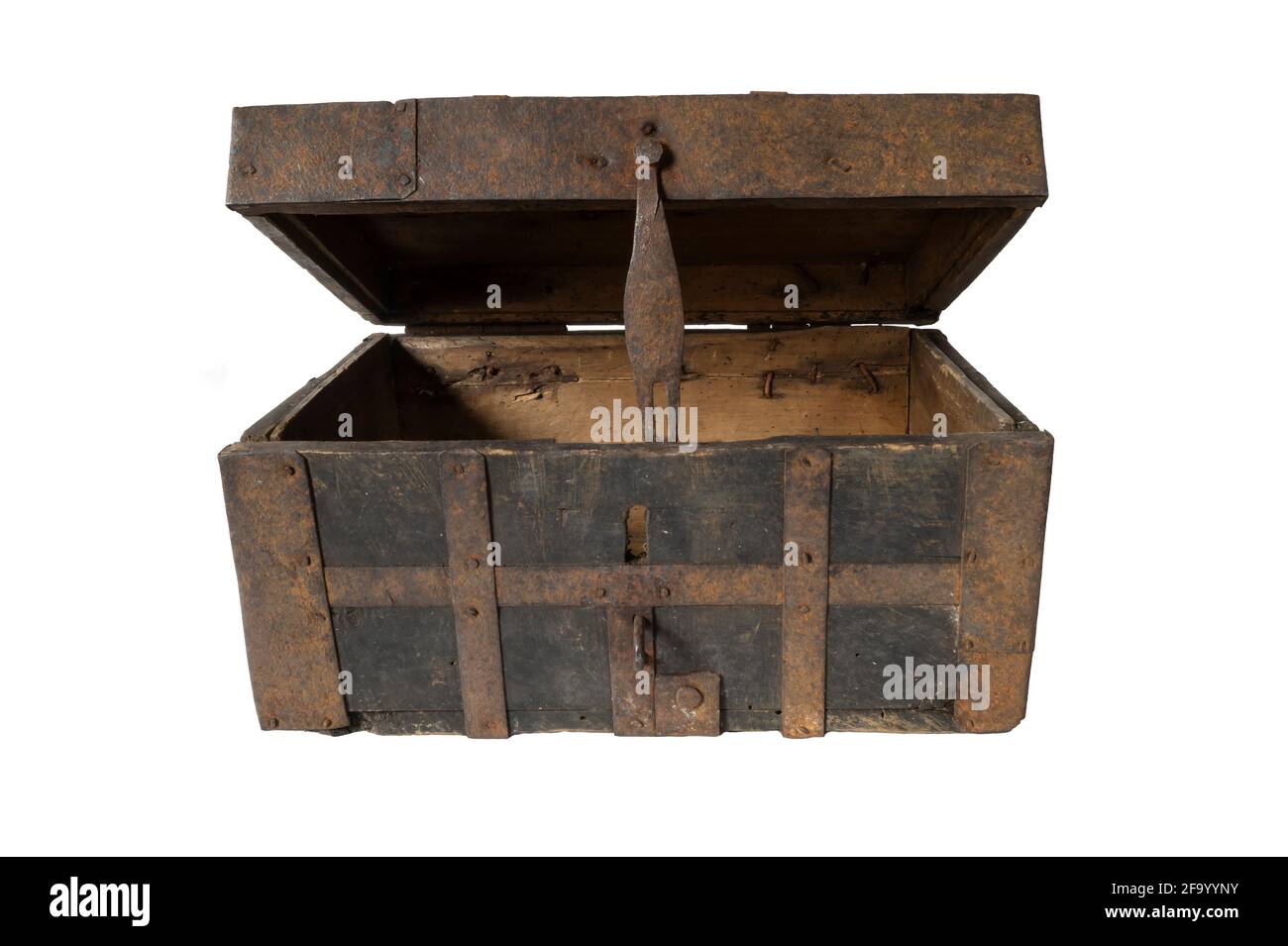 An open old chest on a white background. Wooden box upholstered in iron Stock Photo