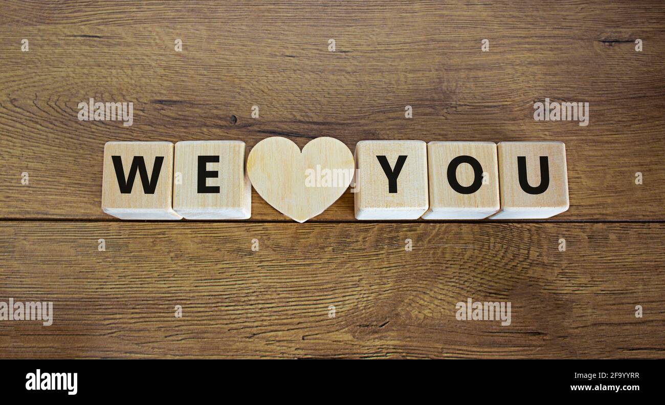 We love you symbol. Wooden cubes and wooden heart with words ‘I love