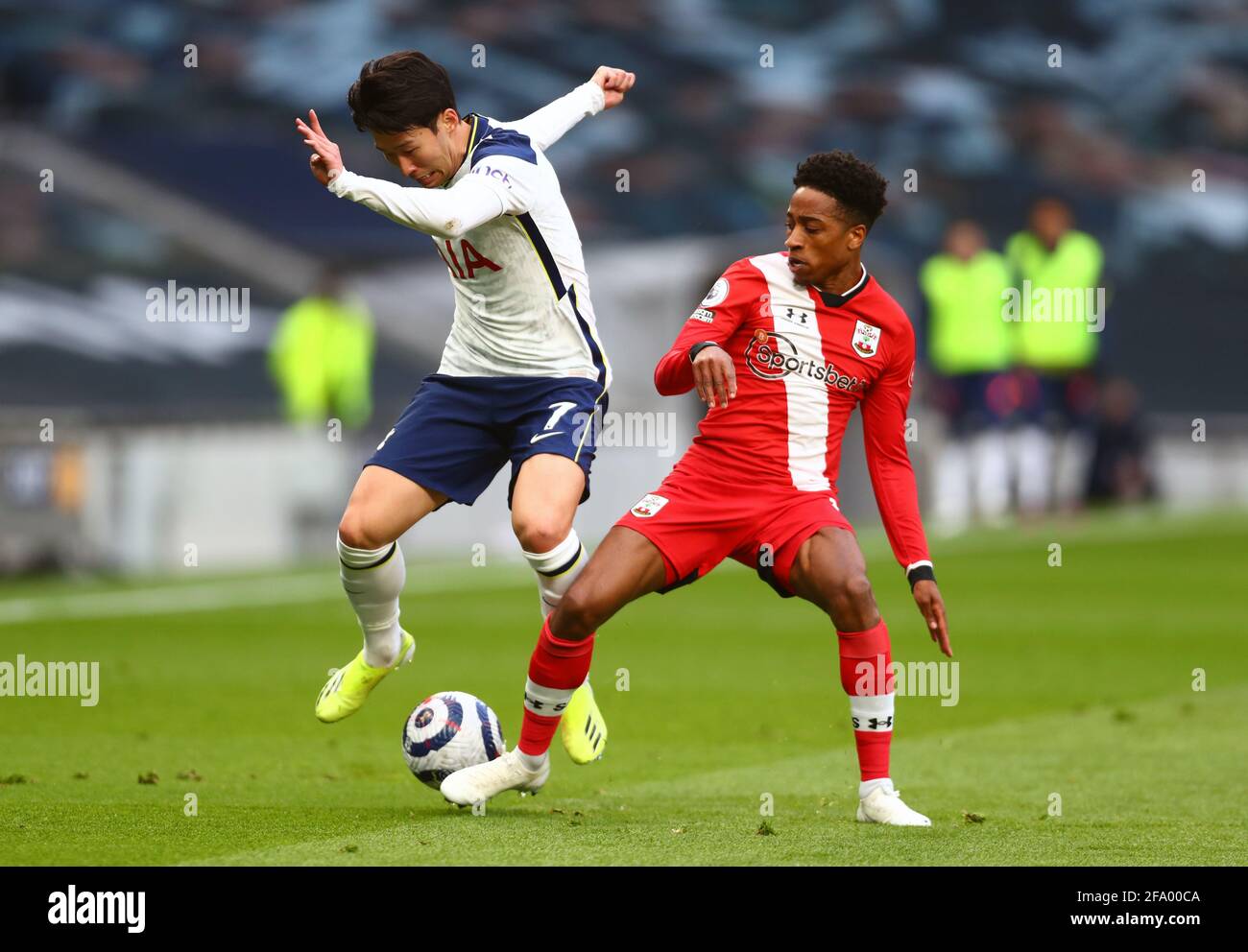 Tottenham Hotspur's Son Heung-min (left) and Southampton's Kyle Walker-Peters (right) battle for the ball during the Premier League match at the Tottenham Hotspur Stadium, London. Picture date: Wednesday April 21, 2021. Stock Photo