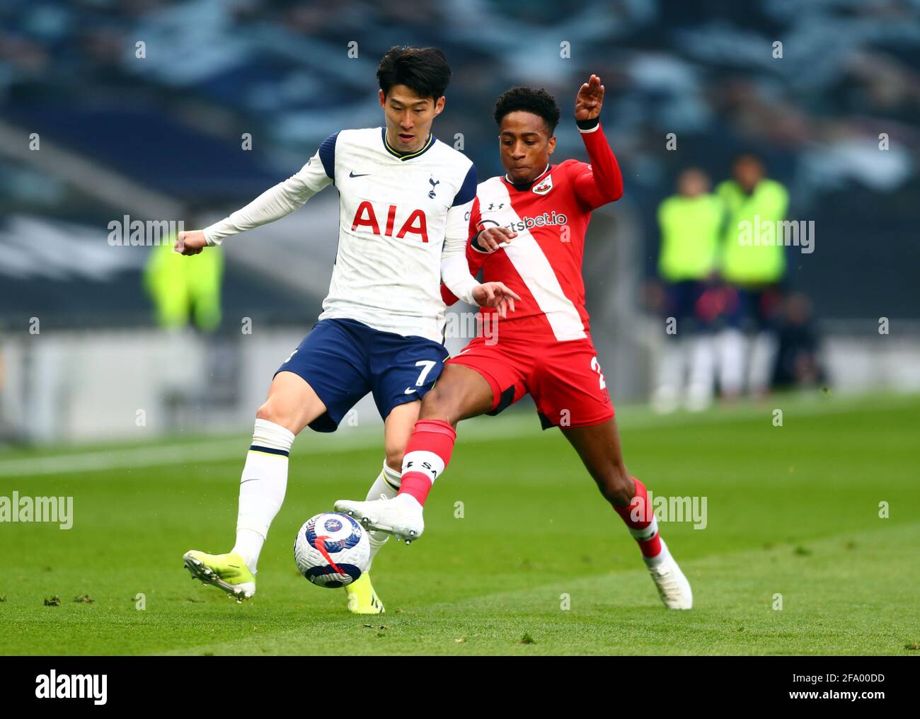 Tottenham Hotspur's Son Heung-min (left) and Southampton's Kyle Walker-Peters (right) battle for the ball during the Premier League match at the Tottenham Hotspur Stadium, London. Picture date: Wednesday April 21, 2021. Stock Photo
