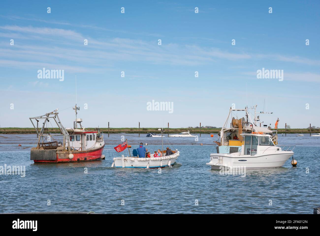 Mersey Island Essex, view of a tour boat leaving West Mersea and taking