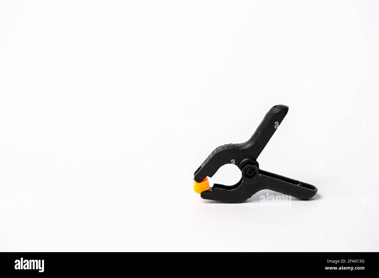 Black industrial clamper isolated on a white background Stock Photo Alamy