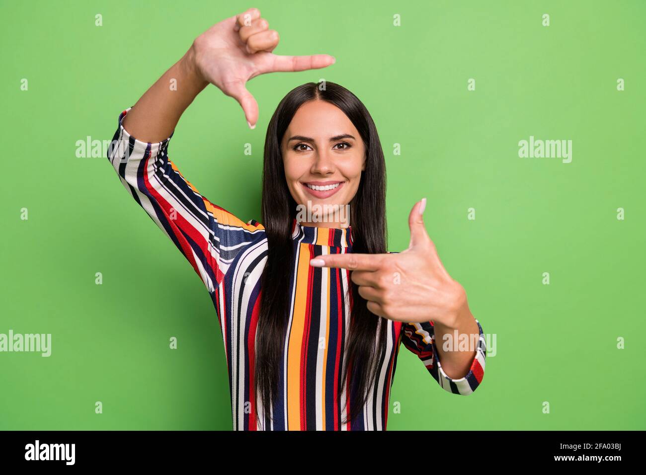 Portrait of attractive cheerful girl showing frame actress film movie