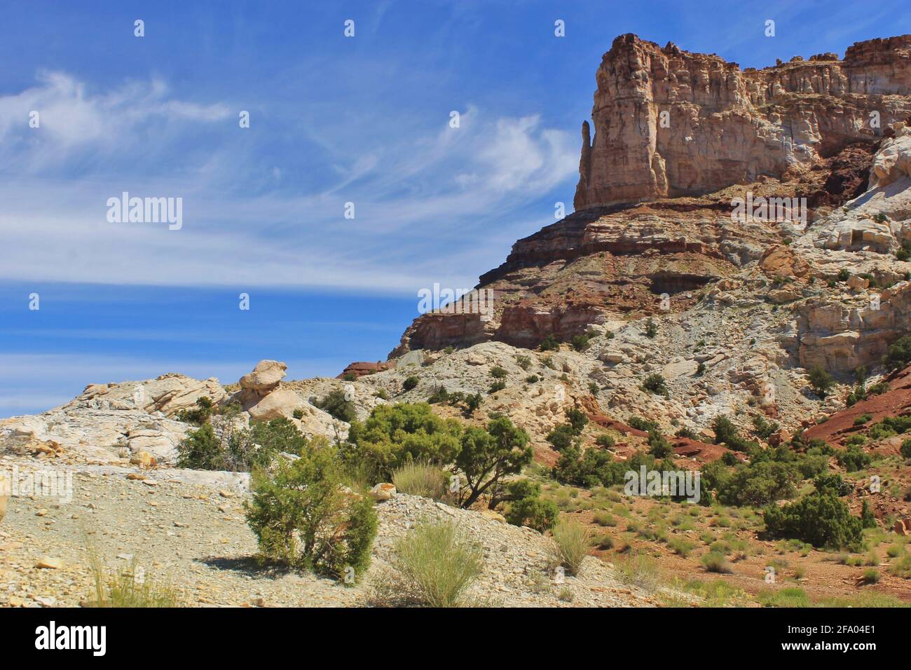 A canyon formation towers above the landscape surrounded by oceans of ...