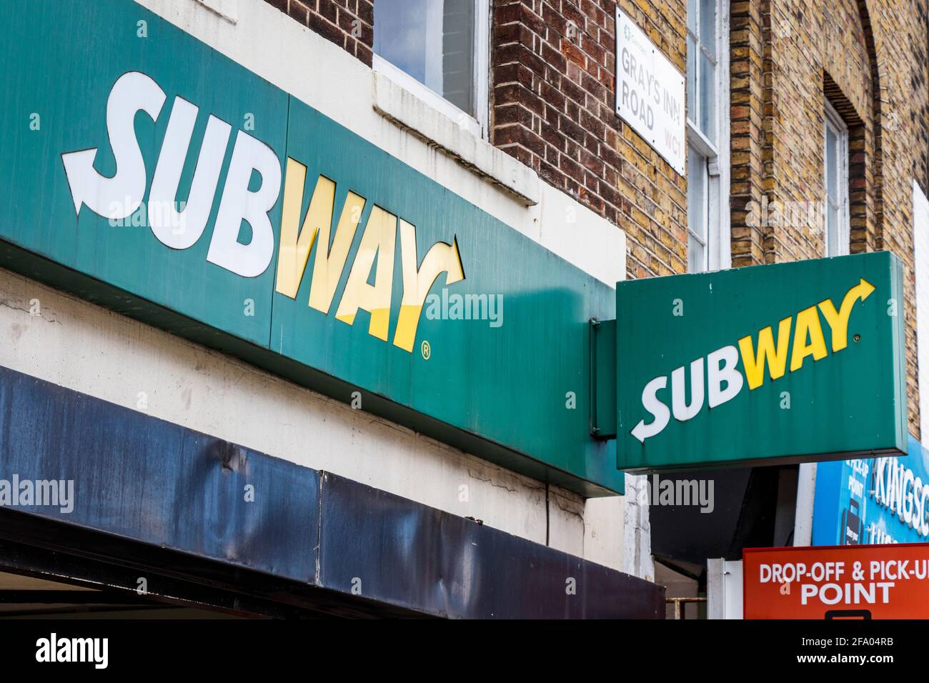 Sign above a branch of Subway fast food outlet on Grays Inn Road, King's Cross, London, UK Stock Photo