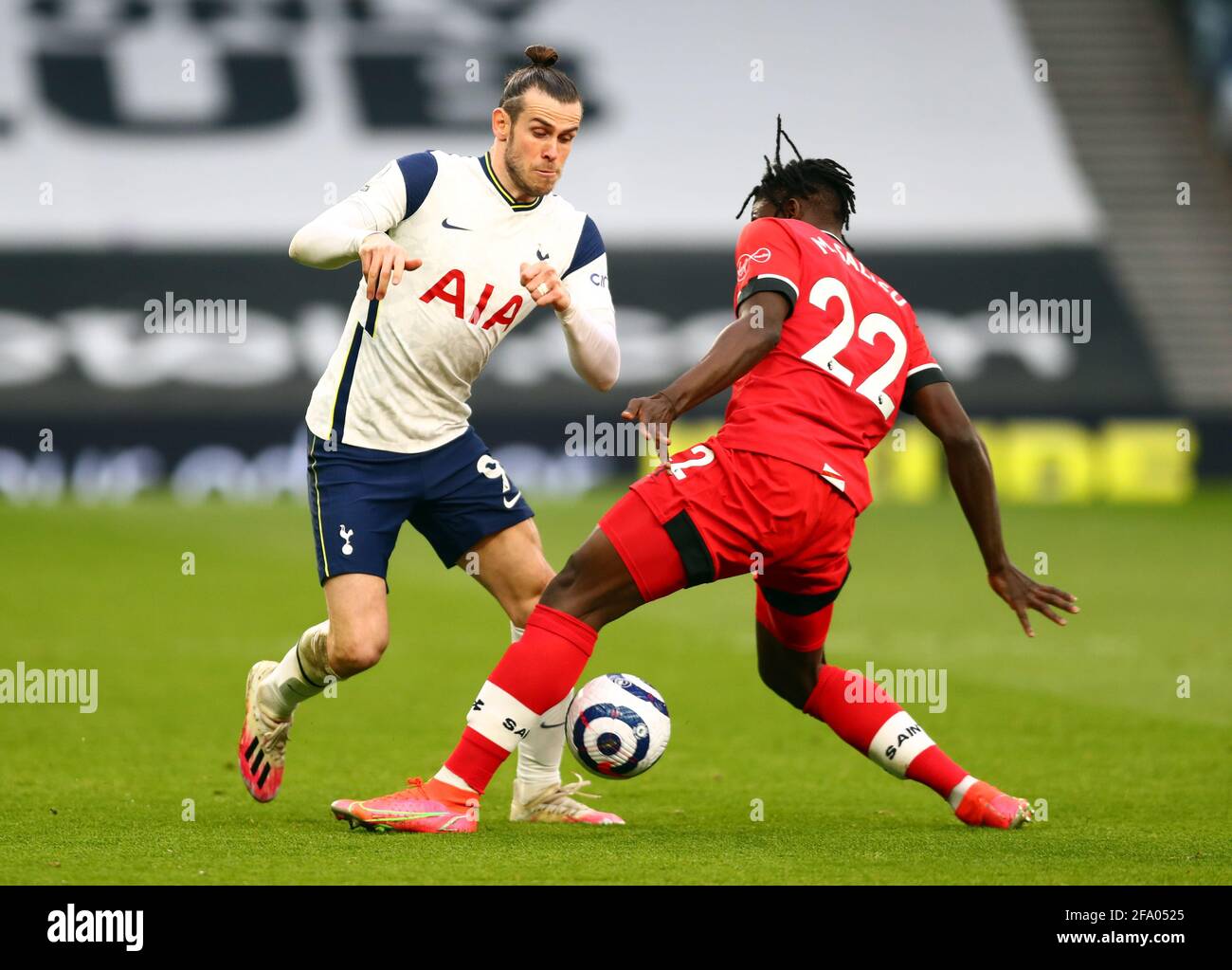 Tottenham Hotspur's Gareth Bale and Southampton's Mohammed Salisu (right) battle for the ball during the Premier League match at the Tottenham Hotspur Stadium, London. Picture date: Wednesday April 21, 2021. Stock Photo