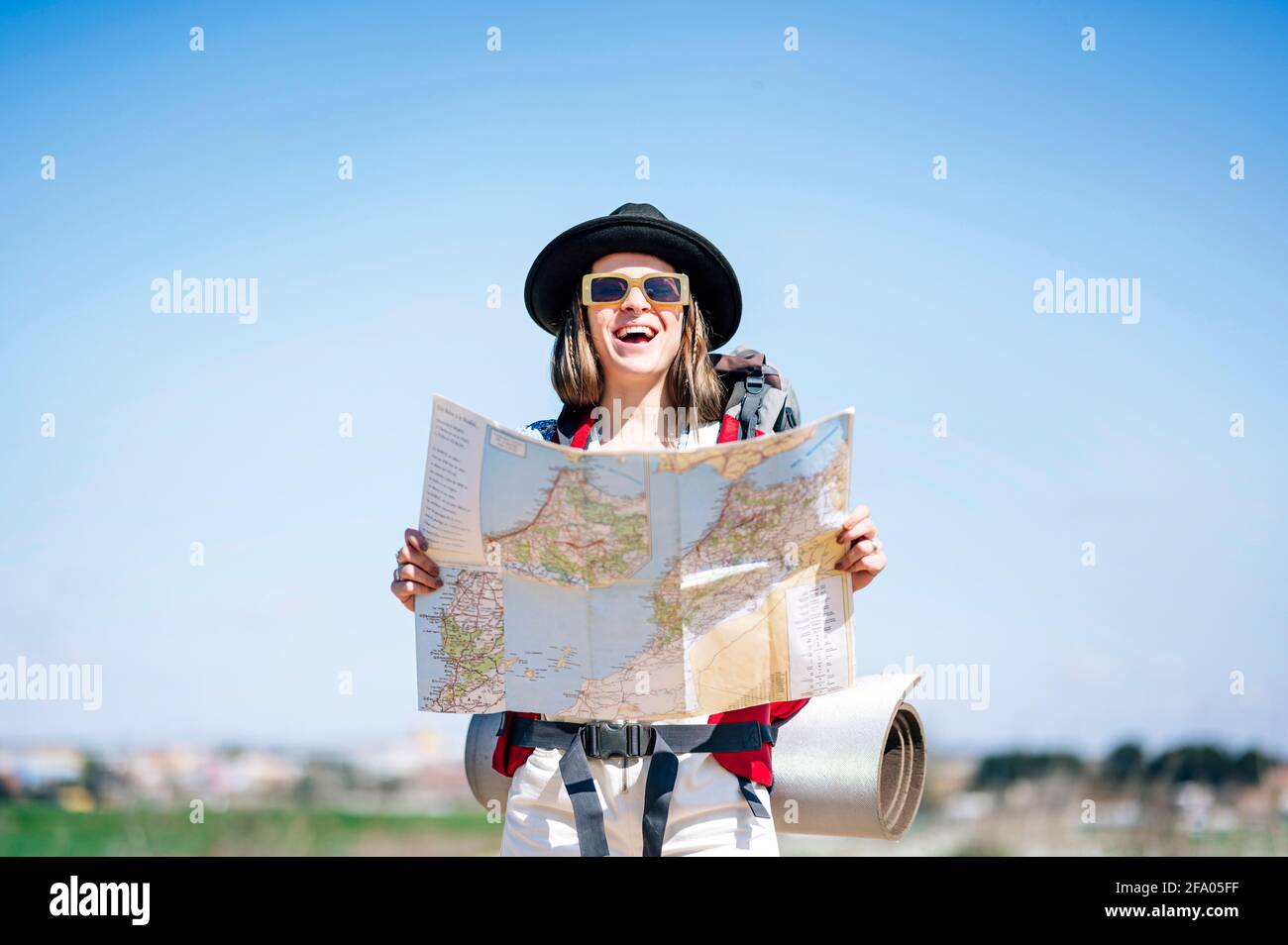 Smiling beautiful woman map hi-res stock photography and images - Alamy