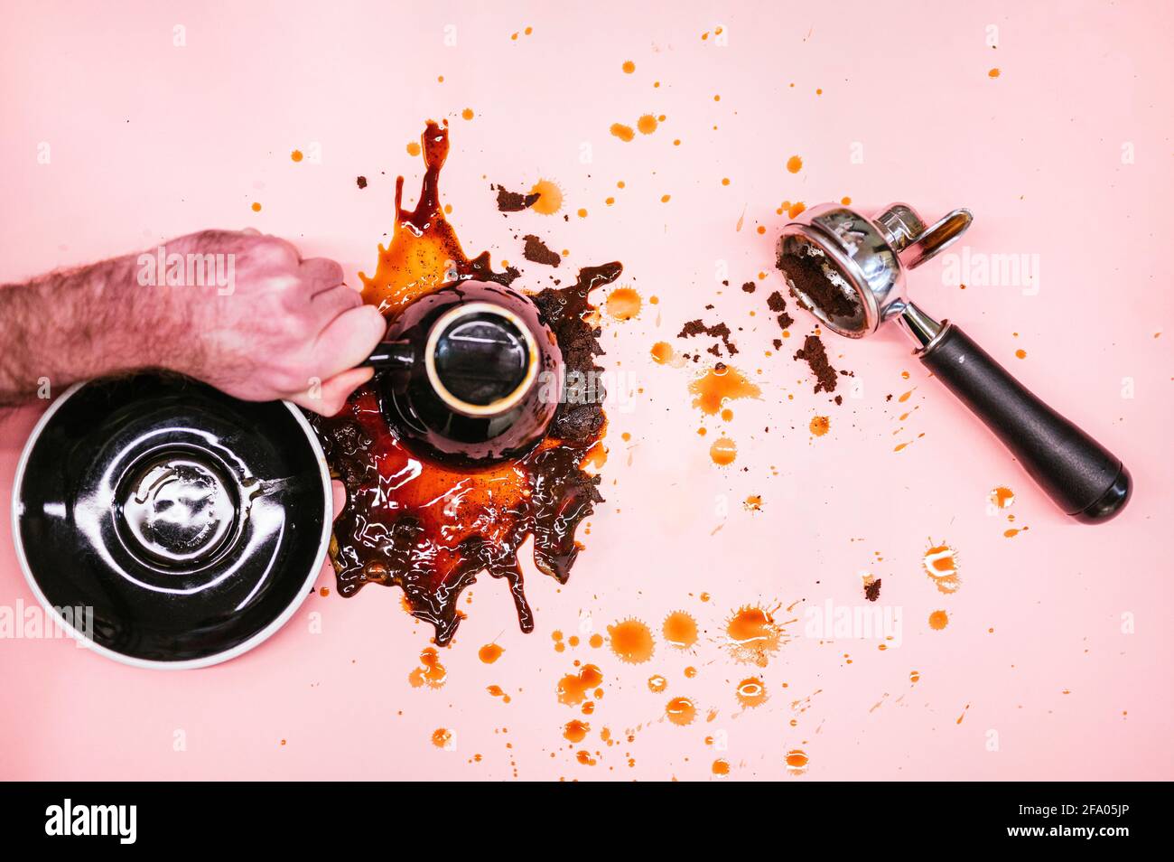 coffee overturned on pink background Stock Photo