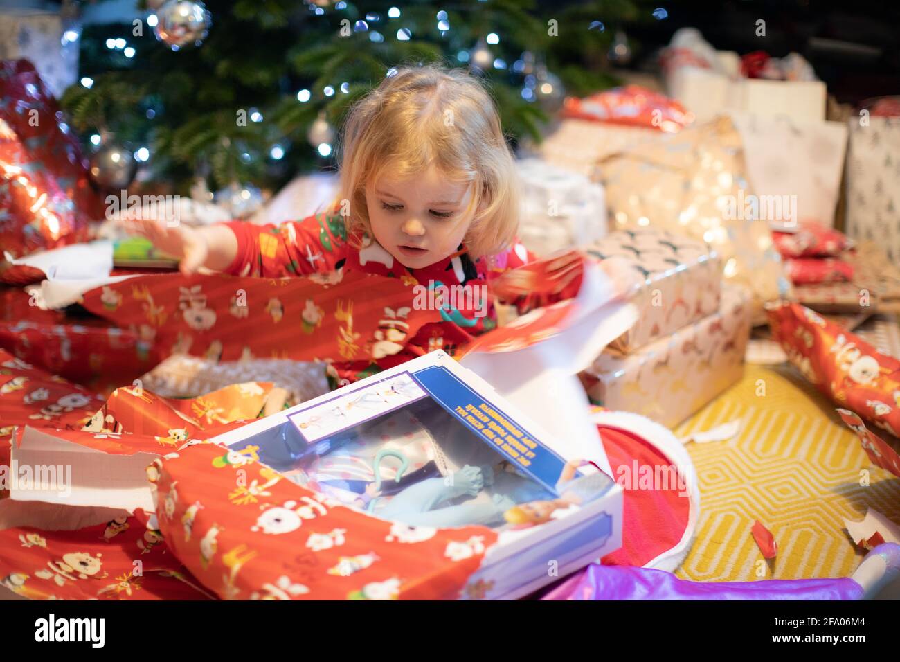 A child opening presents on Christmas Day, UK Stock Photo Alamy