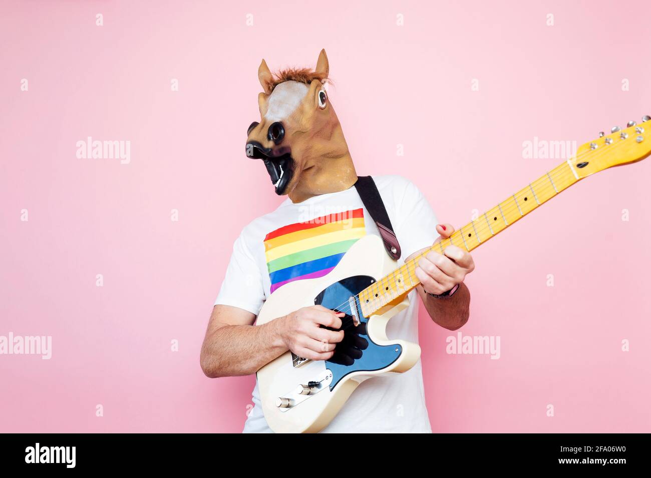man in a horse mask playing electric guitar Stock Photo Alamy