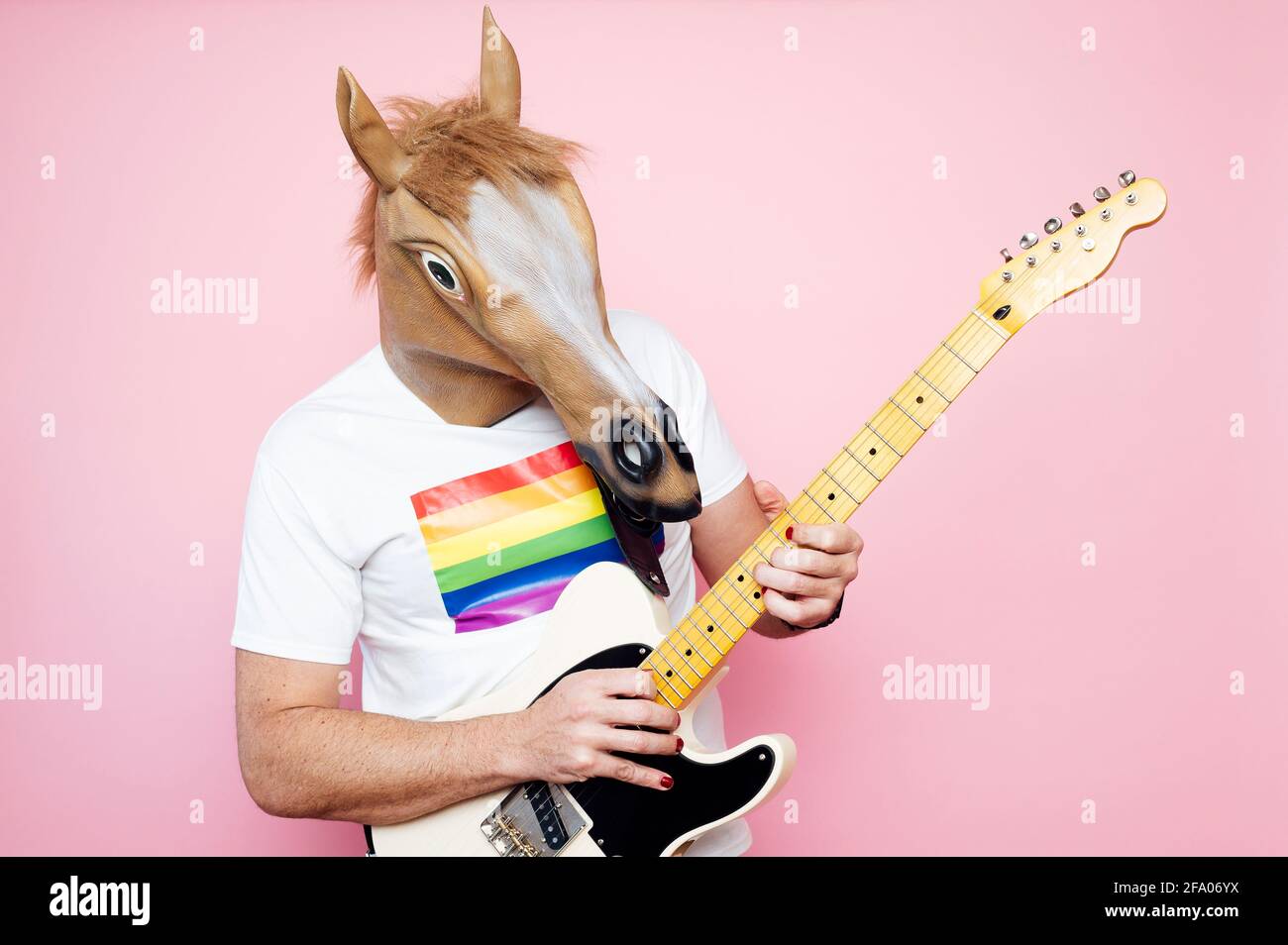 man in a horse mask playing electric guitar Stock Photo Alamy