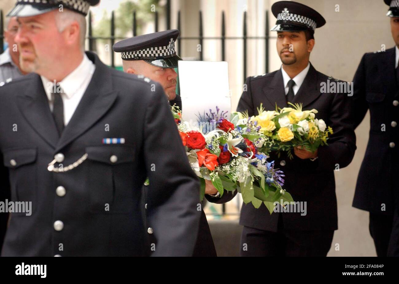 POLICE BRING FLOWERS TO A MEMORIAL SERVICE AT THE BMA FOR THE VICTIMS