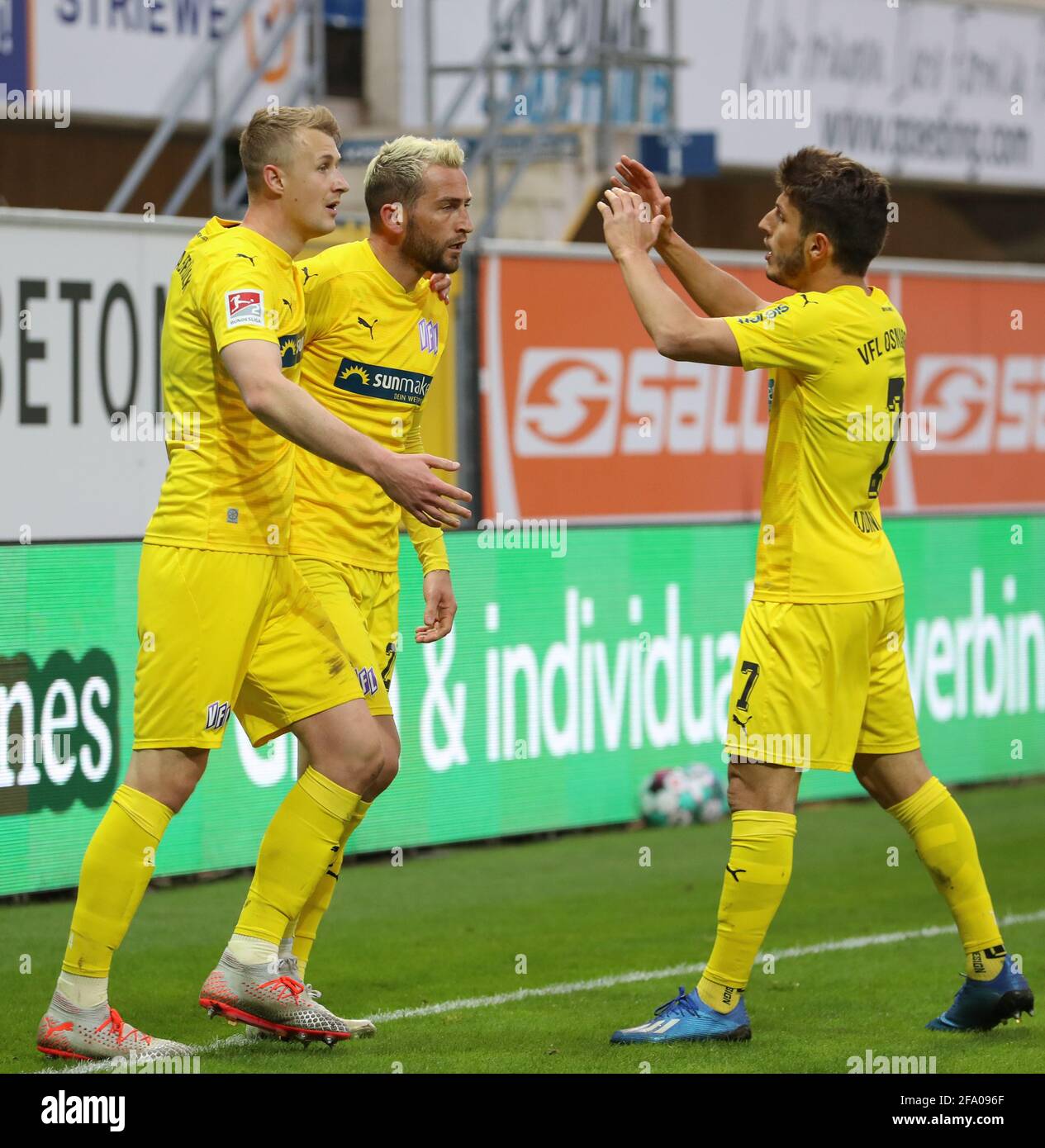 Paderborn, Germany. 21st Apr, 2021. Football: 2nd Bundesliga, SC Paderborn 07 - VfL Osnabrück, Matchday 30 at Benteler-Arena. Osnabrück's goal scorer Marc Heider (centre) celebrates his goal to make it 1:2 with Lukas Gugganig (l-r) and Bashkim Ajdini. Credit: Friso Gentsch/dpa - IMPORTANT NOTE: In accordance with the regulations of the DFL Deutsche Fußball Liga and/or the DFB Deutscher Fußball-Bund, it is prohibited to use or have used photographs taken in the stadium and/or of the match in the form of sequence pictures and/or video-like photo series./dpa/Alamy Live News Stock Photo