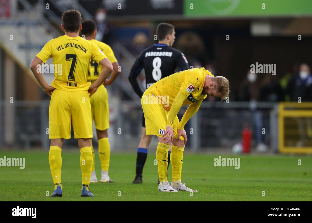 Paderborn, Germany. 21st Apr, 2021. Football: 2. Bundesliga, SC Paderborn 07 - VfL Osnabrück, Matchday 30 at Benteler-Arena. Osnabrück's Bashkim Ajdini and Sebastian Kerk (r) look disappointed at the end of the match. Credit: Friso Gentsch/dpa - IMPORTANT NOTE: In accordance with the regulations of the DFL Deutsche Fußball Liga and/or the DFB Deutscher Fußball-Bund, it is prohibited to use or have used photographs taken in the stadium and/or of the match in the form of sequence pictures and/or video-like photo series./dpa/Alamy Live News Stock Photo