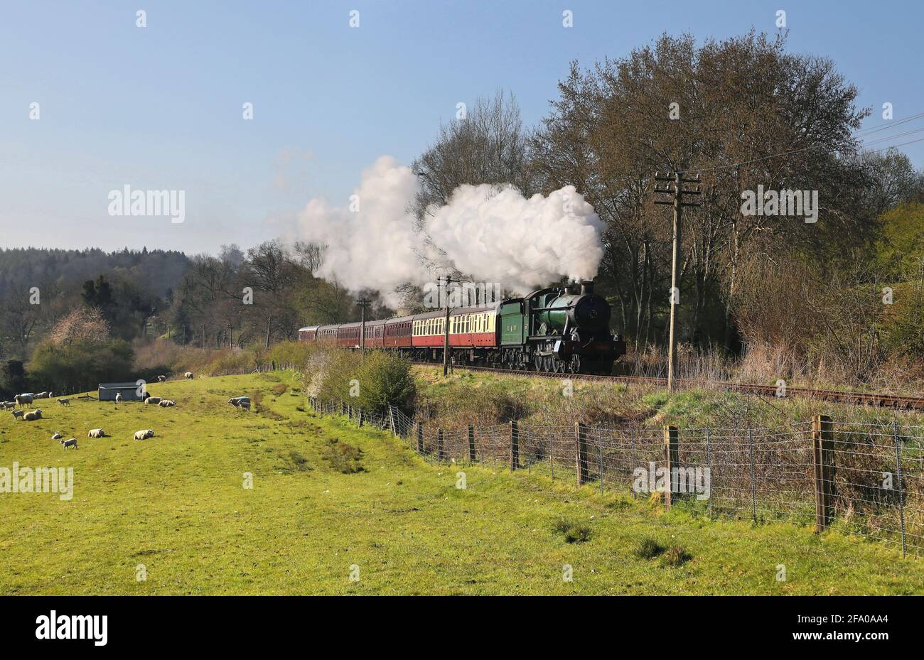 6960 Raveningham Hall heads away from Arley nr Severn lodge on the Severn Valley Railway. Stock Photo