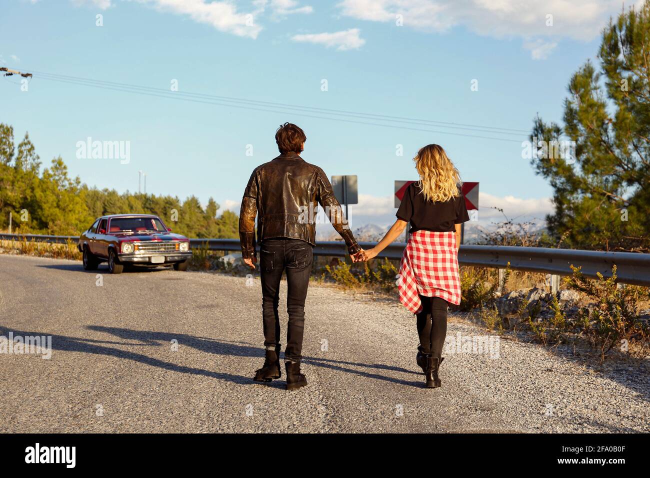 Man walking on winding road hi-res stock photography and images - Alamy