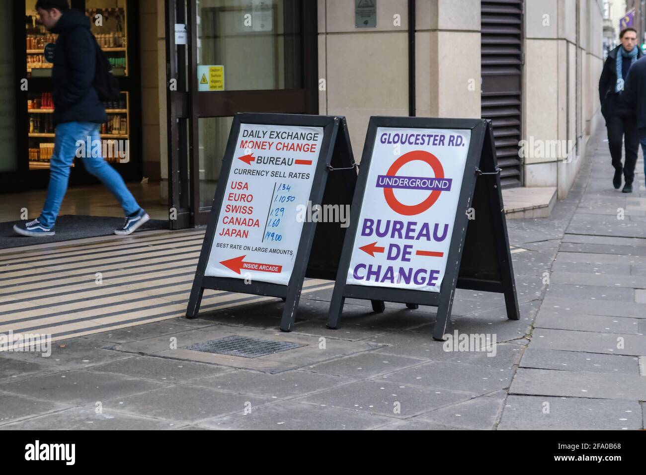 London England 1-10-2018  Signs standing on the sidewalk pointing inside for the Money Exchange and listing various currencies at Glouster Rd Undergro Stock Photo