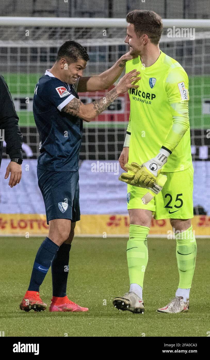 Heidenheim, Germany. 21st Apr, 2021. Football: 2nd Bundesliga, 1. FC Heidenheim - VfL Bochum, Matchday 30 at Voith Arena. Bochum's Christian Gamboa (l) and goalkeeper Patrick Drewes celebrate the victory. Credit: Stefan Puchner/dpa - IMPORTANT NOTE: In accordance with the regulations of the DFL Deutsche Fußball Liga and/or the DFB Deutscher Fußball-Bund, it is prohibited to use or have used photographs taken in the stadium and/or of the match in the form of sequence pictures and/or video-like photo series./dpa/Alamy Live News Stock Photo