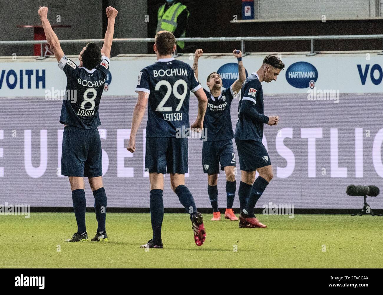 Heidenheim, Germany. 21st Apr, 2021. Football: 2. Bundesliga, 1. FC Heidenheim - VfL Bochum, Matchday 30 at Voith Arena. Bochum's (l-r) Anthony Losilla, Maxim Leitsch, Christian Gamboa and Robert Zulj cheer. Credit: Stefan Puchner/dpa - IMPORTANT NOTE: In accordance with the regulations of the DFL Deutsche Fußball Liga and/or the DFB Deutscher Fußball-Bund, it is prohibited to use or have used photographs taken in the stadium and/or of the match in the form of sequence pictures and/or video-like photo series./dpa/Alamy Live News Stock Photo